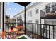 Private balcony with an orange table and chairs, offering an outdoor space at 1078 Piedmont Ne Ave # 106, Atlanta, GA 30309