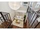 Open loft area with a comfortable couch, a coffee table, and a large light fixture at 1078 Piedmont Ne Ave # 106, Atlanta, GA 30309