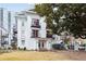 White building exterior with landscaping at 1078 Piedmont Ne Ave # 106, Atlanta, GA 30309