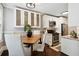 Open concept kitchen and dining area with stainless steel appliances and hardwood floors at 1078 Piedmont Ne Ave # 106, Atlanta, GA 30309