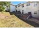 Sloped backyard with a patio and exterior access to home at 1467 Riverrock Trl, Riverdale, GA 30296