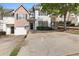 Two story house with attached garage and driveway at 1467 Riverrock Trl, Riverdale, GA 30296