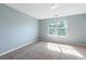 Bedroom featuring light blue walls, carpet flooring, and a window at 1467 Riverrock Trl, Riverdale, GA 30296