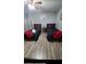 Second bedroom with twin beds and a wood-look floor at 818 Lee Andrews Ave, Atlanta, GA 30315