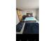 Cozy bedroom featuring a double bed and sliding barn door at 818 Lee Andrews Ave, Atlanta, GA 30315
