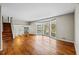 Open living room with hardwood floors and a large bay window at 2592 Evergreen Trl, Smyrna, GA 30082