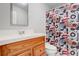 Small bathroom with single vanity and shower at 174 Rivertown Rd, Fairburn, GA 30213