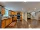 Open concept basement kitchen with stainless steel appliances and hardwood floors at 174 Rivertown Rd, Fairburn, GA 30213