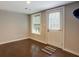 Finished basement room with hardwood floors and exterior access at 174 Rivertown Rd, Fairburn, GA 30213