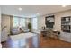 Spacious home office with hardwood floors and large windows at 174 Rivertown Rd, Fairburn, GA 30213