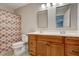 Bathroom with double vanity and updated fixtures at 174 Rivertown Rd, Fairburn, GA 30213
