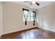 Well-lit bedroom featuring hardwood floors at 174 Rivertown Rd, Fairburn, GA 30213