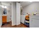 Basement laundry room with washer, dryer, and bathroom access at 174 Rivertown Rd, Fairburn, GA 30213
