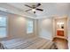 Bright bedroom with hardwood floors and ensuite bathroom at 174 Rivertown Rd, Fairburn, GA 30213