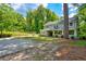 Charming two-story home with a porch and well-maintained landscaping at 174 Rivertown Rd, Fairburn, GA 30213