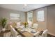 Bright dining area with wood table and six chairs at 174 Rivertown Rd, Fairburn, GA 30213