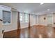 Finished basement with hardwood floors and an exterior entrance at 174 Rivertown Rd, Fairburn, GA 30213