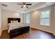 Spacious bedroom with hardwood floors and ceiling fan at 174 Rivertown Rd, Fairburn, GA 30213