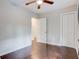 Simple bedroom with hardwood floors and closet at 174 Rivertown Rd, Fairburn, GA 30213