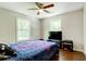 Bedroom with hardwood floors and TV stand at 174 Rivertown Rd, Fairburn, GA 30213