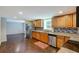 Spacious basement kitchen with stainless steel appliances and granite countertops at 174 Rivertown Rd, Fairburn, GA 30213