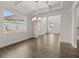 Dining room with hardwood floors, coffered ceiling, and chandelier at 4040 Gallery Chase, Cumming, GA 30028