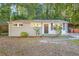 Gray brick ranch house with a covered carport at 398 Cologne Se Dr, Atlanta, GA 30354