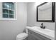 Modern bathroom with gray vanity and marble shower at 398 Cologne Se Dr, Atlanta, GA 30354