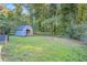 Large backyard with shed and wooded area at 398 Cologne Se Dr, Atlanta, GA 30354