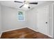 Bright bedroom featuring hardwood floors and a ceiling fan at 398 Cologne Se Dr, Atlanta, GA 30354
