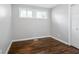 Simple bedroom with hardwood floors and a window at 398 Cologne Se Dr, Atlanta, GA 30354