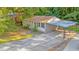 Aerial view of house, carport, and surrounding trees at 398 Cologne Se Dr, Atlanta, GA 30354
