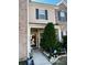 Inviting brick front exterior with landscaping and walkway at 2555 Flat Shoals Rd Apt # 3305, College Park, GA 30349