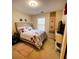 Well-lit bedroom with a queen bed and calming decor at 2555 Flat Shoals Rd Apt # 3305, College Park, GA 30349