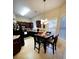 Kitchen with dark wood cabinets, black appliances, and breakfast nook at 2555 Flat Shoals Rd Apt # 3305, College Park, GA 30349