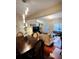 Open dining room with hardwood floors and a stylish chandelier at 2555 Flat Shoals Rd Apt # 3305, College Park, GA 30349