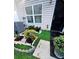 Landscaped backyard with artificial turf and decorative stones at 2555 Flat Shoals Rd Apt # 3305, College Park, GA 30349