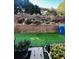 Landscaped backyard with retaining wall and artificial turf at 2555 Flat Shoals Rd Apt # 3305, College Park, GA 30349
