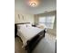 Spacious bedroom with a queen bed and window, featuring a calming decor at 2555 Flat Shoals Rd Apt # 3305, College Park, GA 30349