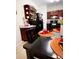 Well-equipped kitchen with dark wood cabinets and breakfast bar at 2555 Flat Shoals Rd Apt # 3305, College Park, GA 30349