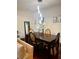 Elegant dining room with hardwood floors and a modern chandelier at 2555 Flat Shoals Rd Apt # 3305, College Park, GA 30349