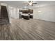 Spacious living room with hardwood floors and access to kitchen and stairs at 5120 Lower Elm St, Atlanta, GA 30349