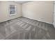 Bright bedroom featuring neutral walls and grey carpeting at 5120 Lower Elm St, Atlanta, GA 30349