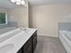 Double vanity bathroom with soaking tub and separate shower at 5120 Lower Elm St, Atlanta, GA 30349