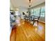 Dining room with hardwood floors and large windows at 684 N Cherokee N Rd, Social Circle, GA 30025