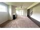 Gathering room with fireplace and access to backyard via French doors at 2469 Osceola Rd, Lithonia, GA 30058
