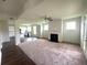 Open Gathering room with fireplace and French doors to backyard at 2469 Osceola Rd, Lithonia, GA 30058