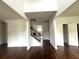 Two story foyer with hardwood floors and an elegant staircase at 2469 Osceola Rd, Lithonia, GA 30058