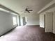Bright main bedroom with ceiling fan and carpeted floors at 2469 Osceola Rd, Lithonia, GA 30058