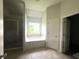 Main bathroom with soaking tub, shower, and tile floors at 2469 Osceola Rd, Lithonia, GA 30058